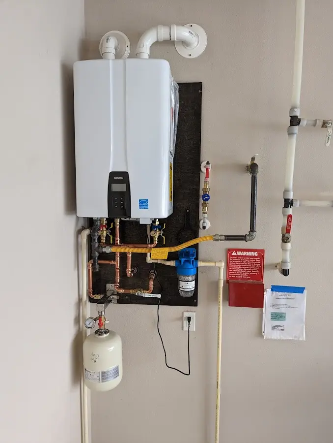 Professional plumber installing copper piping in a Whitemarsh Island home